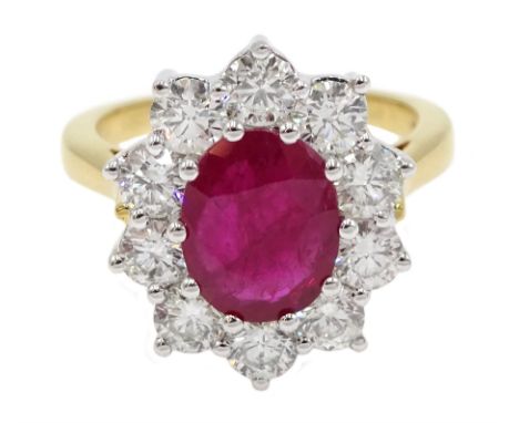  18ct gold oval ruby and round brilliant cut diamond cluster ring, hallmarked, ruby 2.25 carat, total diamond weight 1.50 car