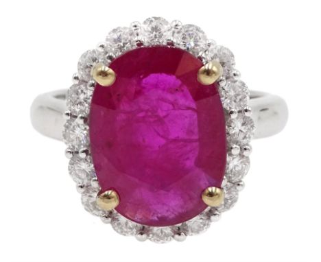  18ct white gold oval ruby and diamond cluster ring, stamped 750, ruby approx 3.80 carat, diamond total weight 0.81 carat  [i