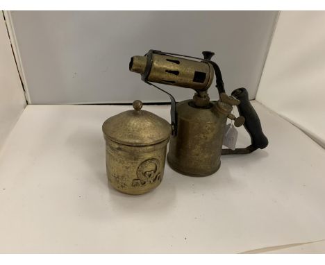 A BRASS BLOW LAMP AND A BRASS LIDDED POT 
