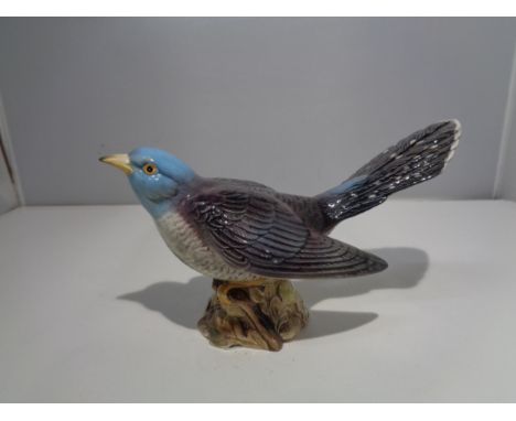 A BESWICK FIGURE MODEL 2315 THE CUCKOO 