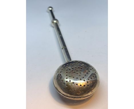 A VINTAGE SILVER PLATED TEA STRAINER 