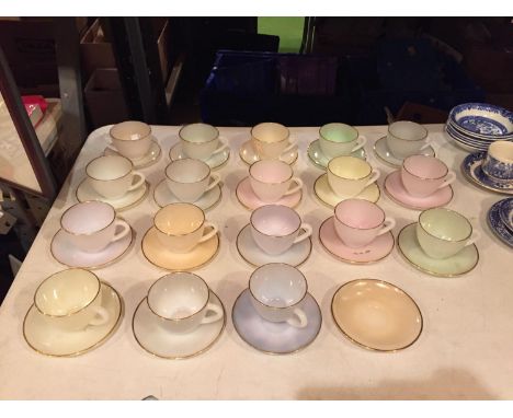 A NUMBER OF LARGE ARCOPAL OPALESCENT TEACUPS AND SAUCERS 