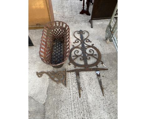 A HEAVY METAL PLANTER, A DECORATIVE GARDEN FEATURE AND A HANGING BASKET BRACKET 