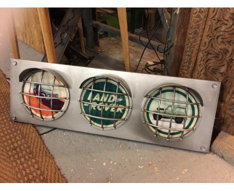 A LARGE LAND ROVER ILLUMINATED TRAFFIC LIGHT STYLE SIGN WITH HEADLIGHT DESIGN SIZE 36.5 INCHES/93CM X 12 INCHES/30CM 