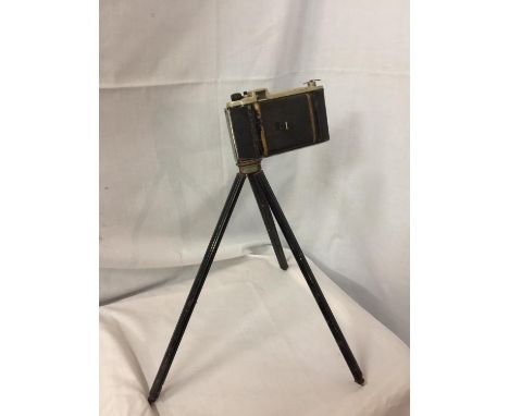 A VINTAGE KODAK CAMERA AND SMALL TRIPOD 