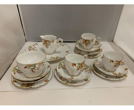 BELL CHINA CUPS, SAUCERS, PLATES, ETC IN A DELICATE ORANGE, YELLOW AND GREEN FLORAL PATTERN 