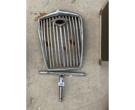A VINTAGE STAINLESS STEEL CAR GRILL 