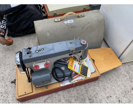 A VINTAGE JONES ELECTRIC SEWING MACHINE 