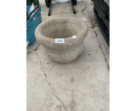 A SMALL RECONSTITUTED STONE PLANTER 