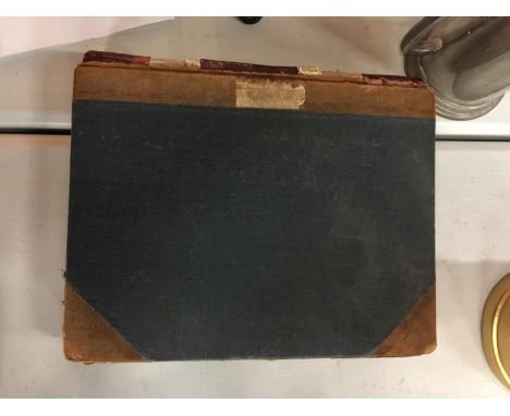 A VINTAGE RECEIPT BOOK WITH HANDWRITTEN RECEIPTS 
