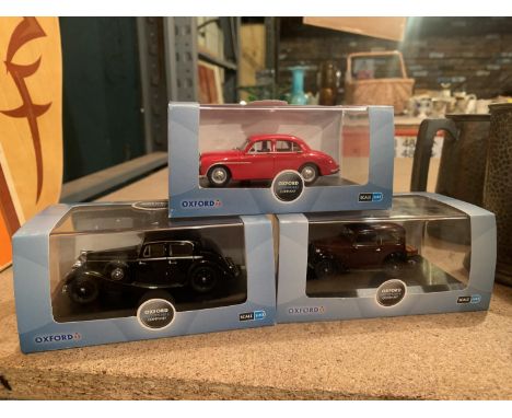 THREE BOXED OXFORD DIE CAST MODELS TO INCLUDE A SCALE 1:43 BLACK JAGUAR, AN AUSTIN RUBY SALOON AND A RED MGZA MAGNETTE 