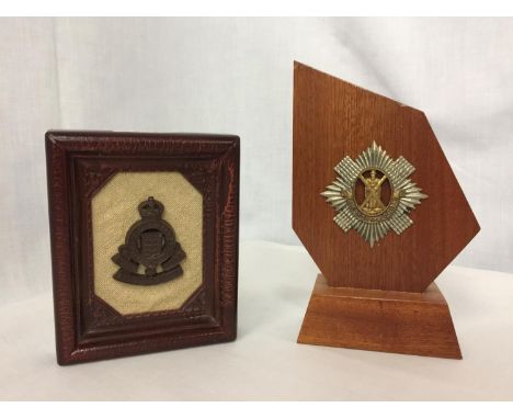 A WOODEN MOUNTED ROYAL SCOTS BADGE AND A FRAMED ROYAL ARMY ORDINANCE CORPS BADGE (2) 