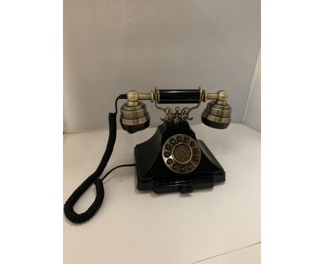 A VINTAGE STYLE BLACK AND BRASS PUSH BUTTON TELEPHONE WITH A PULL OUT NUMBER TRAY 