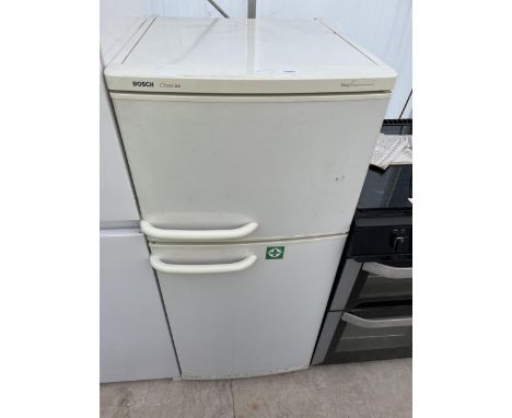 A WHITE BOSCH CLASSIX UPRIGHT FRIDGE FREEZER WITH INSTRUCTION MANUAL 