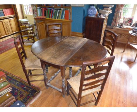 A VICTORIAN OAK GATE LEG DINING TABLE WITH TURNED SUPPORTS AND STRETCHER RAILS 111CM X 142CM TOGETHER WITH FOUR LANCASHIRE ST