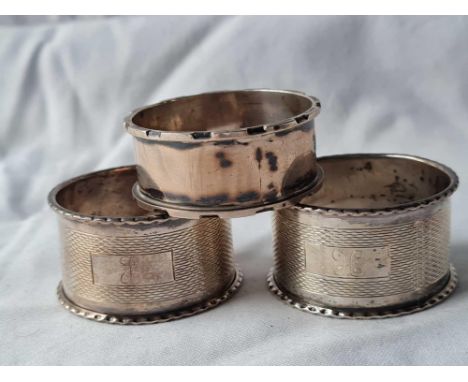 A pair of engine turned napkin rings, Birmingham 1957 and another, 35 g.