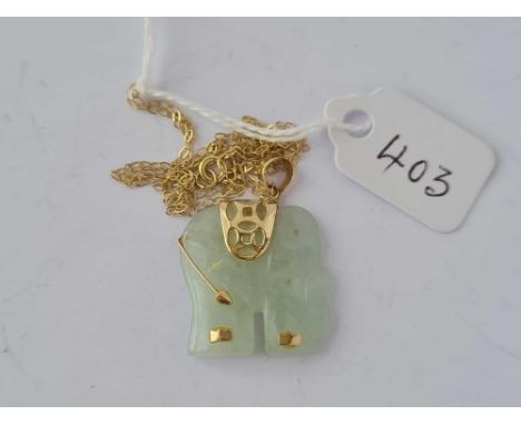 A gold mounted carved jade elephant pendant/necklace  4.2 gms