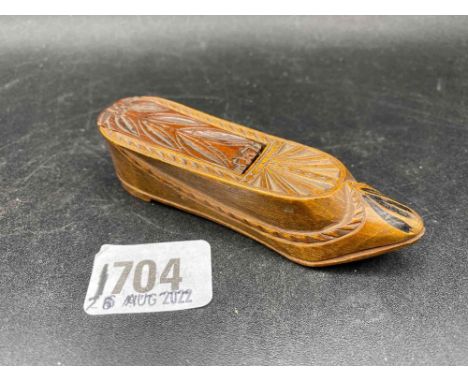 A treen snuff box in the form of a shoe with sliding top
