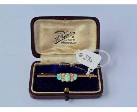 A attractive opal and diamond bar brooch set in gold  3.7 gms