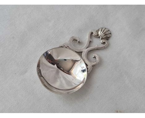 An unusual caddy spoon with pierced and shell decorated handle, circular bowl, Edinburgh 1942