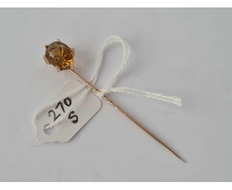 A large topaz Victorian stick pin in gold