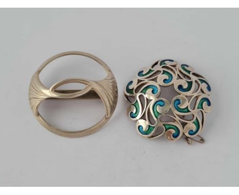 A silver and enamel brooch and one silver modern brooch