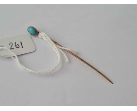 A single stone turquoise Victorian stick pin set in gold