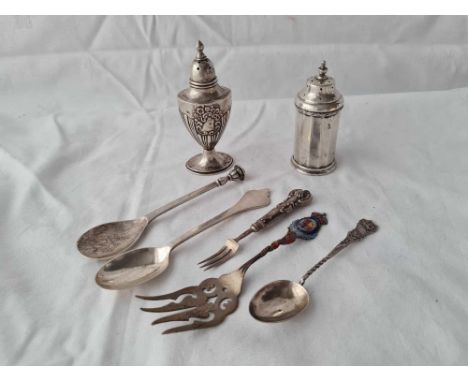 An urn shaped pepper, another pepper and an enamel decorated sterling fork, 146g