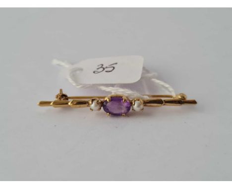 A amethyst and pearl brooch 9ct  1,5 gms