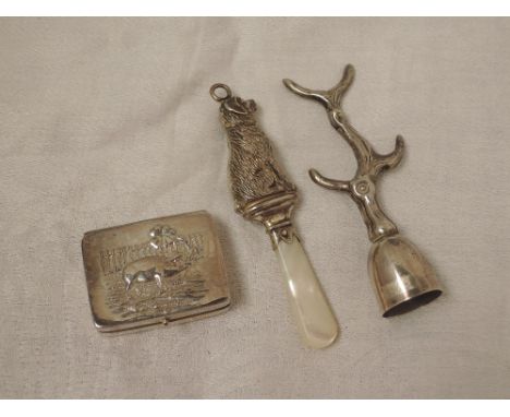 A small HM silver patch box bearing pig with shamrock leaf to lid, an HM silver rattle in the form of a dog with mother of pe