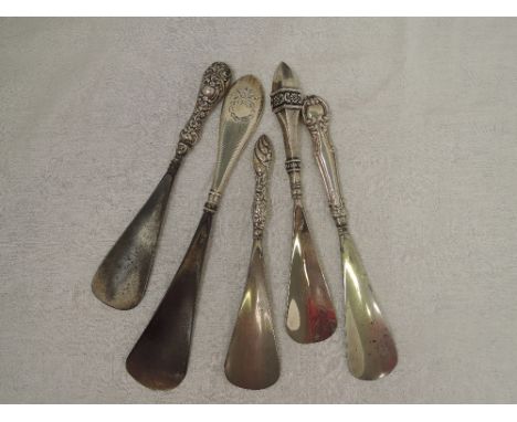 Five HM silver handled shoe horns of various forms