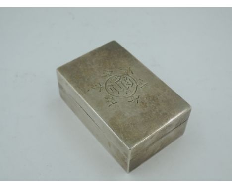 A small Victorian silver box of plain rectangular form bearing monogram to push on lid and presentation inscription to base, 