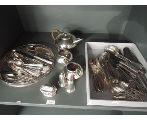 A selection of silver plate including table lighter, three piece tea set, circular gallery tray, cruet, Community plate flatw