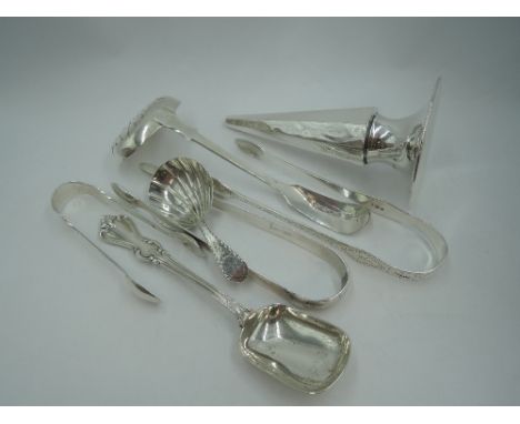 A selection of HM silver including two pairs of Georgian sugar nips, one having Newcastle marks, a Georgian caddy spoon havin