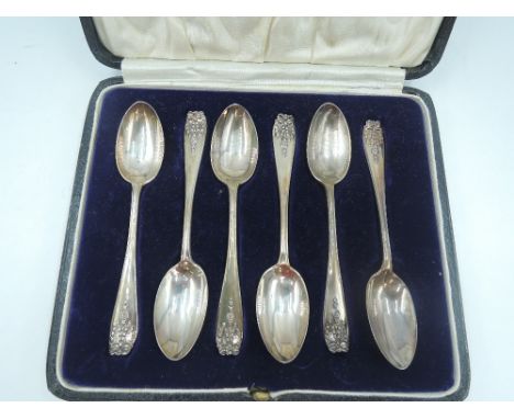 A cased set of six silver teaspoons having moulded floral swag  decoration, London 1925/27, Josiah Williams &amp; Co, approx 
