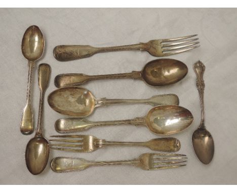 A selection of Georgian silver flatware including dessert &amp; tea spoons and forks of fiddle back form bearing crest to ter