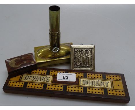 A Dewar's whisky and advertising cribbage board, a small icon, a brass inlaid box and a patent brass candle holder (4)