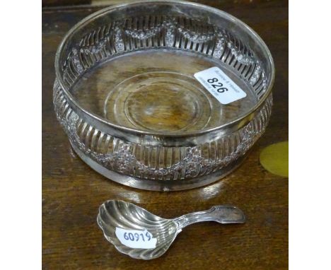 A Georgian silver caddy spoon and a silver plate on copper wine coaster