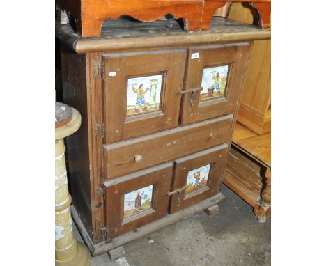 A Continental pine fitted cupboard and drawer with inset tile panels, width 93 cm