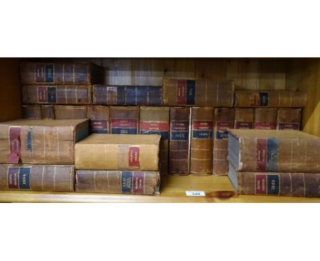 A shelf of leather-bound volumes ""Racing Calendar""