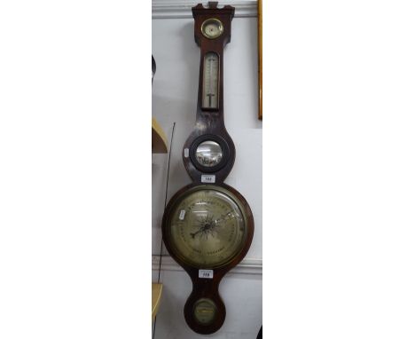 An Antique aneroid wall barometer with thermometer, inlaid stringing.