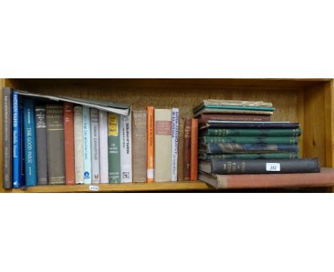 A shelf of books about India