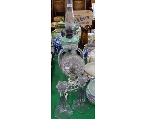 An oil lamp with milk-glass font, basket, glass table lamp in 2-parts and candlesticks