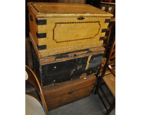 A Victorian originally painted pine blanket chest, another and a tin trunk