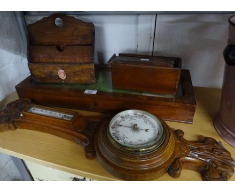 A table top display case, stationery rack, barometer and a box