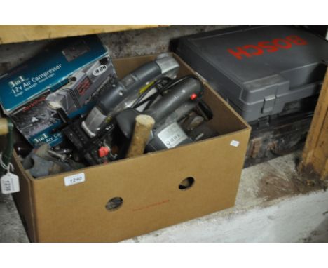 A collection of cased power tools, and a box of planes, circular saw, vice etc