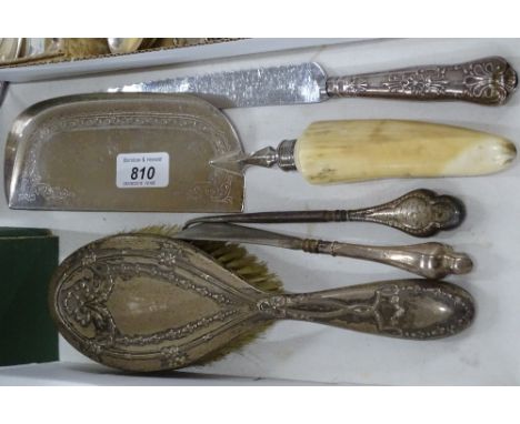 A Victorian engraved ivory handled crumb tray, silver backed brush, silver handled shoehorn, button hook and carving knife