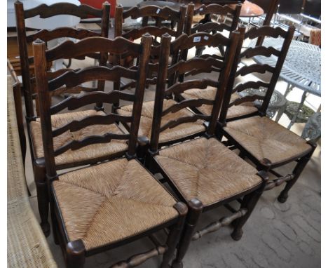A set of 6 oak ladder-back dining chairs, rush seats, turned legs