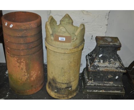 A Victorian cast-iron rain hopper, 2 chimney pots