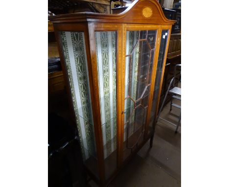 An Edwardian mahogany and satinwood banded display cabinet, with a single lattice glazed door, raised on splayed legs, width 